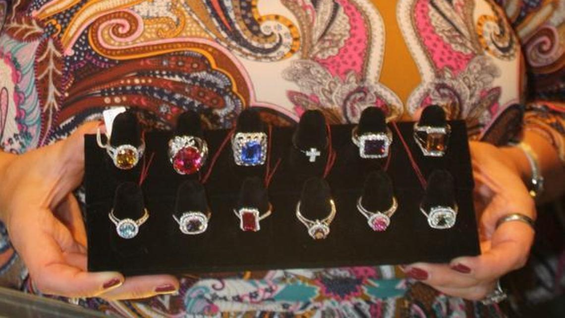 K.A.T. Jewelry owner Kimmy Taake with some of the rings she sells. It’s hard to tell the lab-made stones from the natural ones.