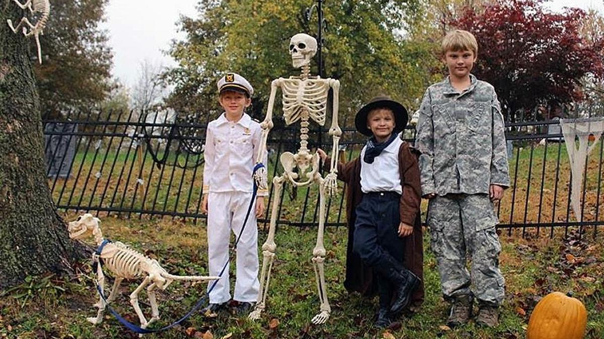 The McDaniel boys, Jeremy, 8, left, Josh, 5, and Jacob, 11, get a kick out of mom Deb’s Halloween decorations.