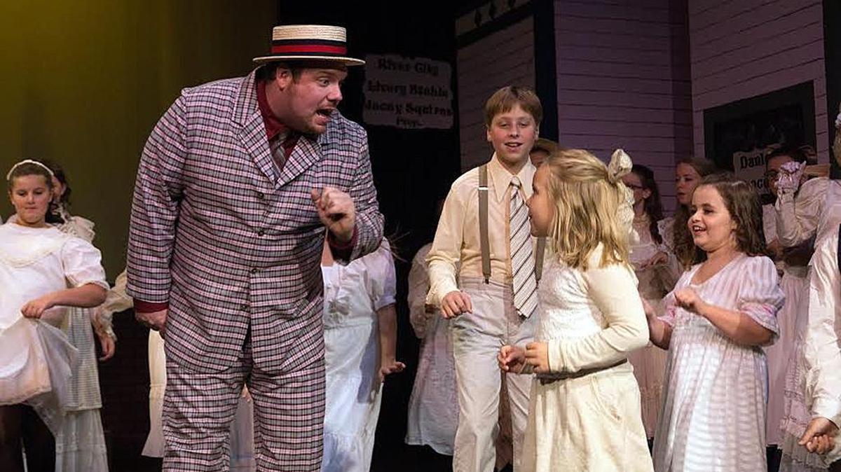 
Josh Noll plays Harold Hill in a scene from “The Music Man” at the Looking Glass Playhouse in Lebanon. The musical runs Thursday through Sunday through Oct. 4.
