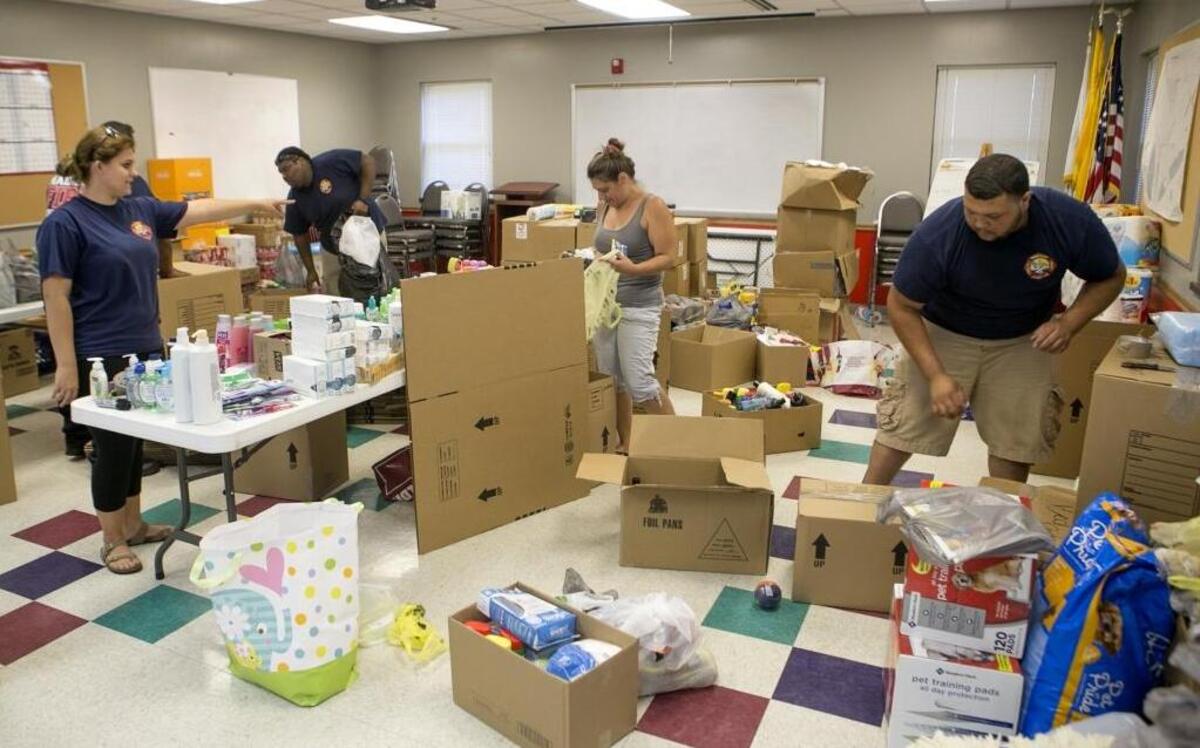 The Pentecostals of Troy will have “Stock the Trailer,” an event to aid the survivors of hurricane Harvey, from 4:30-6:30 p.m. Thursday and Friday, and from 9-11 a.m. Saturday and Sunday, at 8965 Route 162, Troy. Pictured: Madison city employees and firefighters sort, organize and box donations for relief from Hurricane Harvey in Texas.