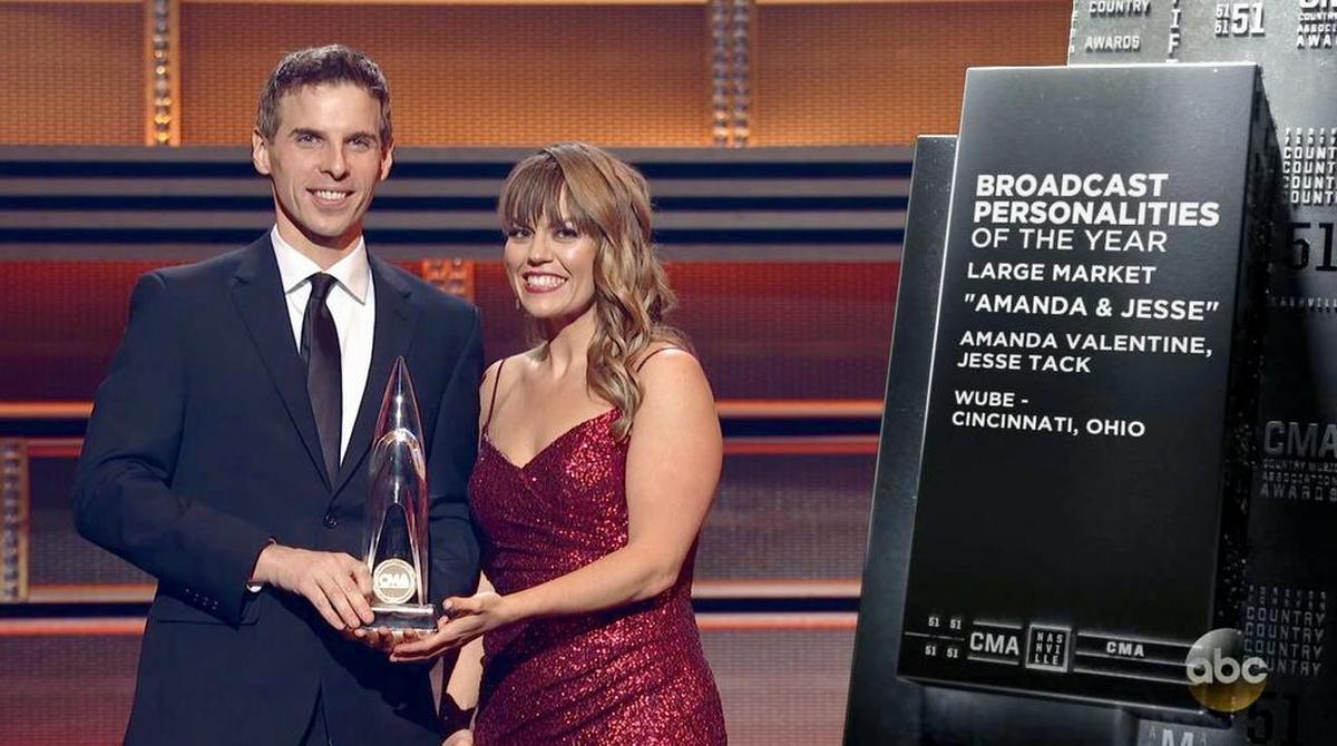 Amanda Valentine rocks her slinky red gown, with radio partner Jesse Tack, at the CMAs. They won Large Market On-Air Personality of the Year.
