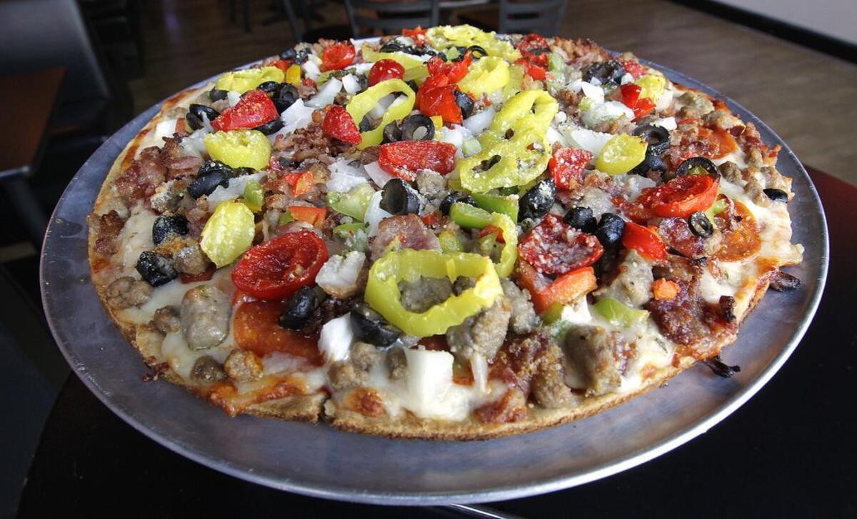 Fifth Quarter Pub & Grill in Collinsville serves a variety of pizza, including the Supreme with pepperoni, sausage, bacon, onions, tomatoes, black olives and mushrooms ($11 for nine-inch, $13 for 12-inch or $17 for 16-inch).