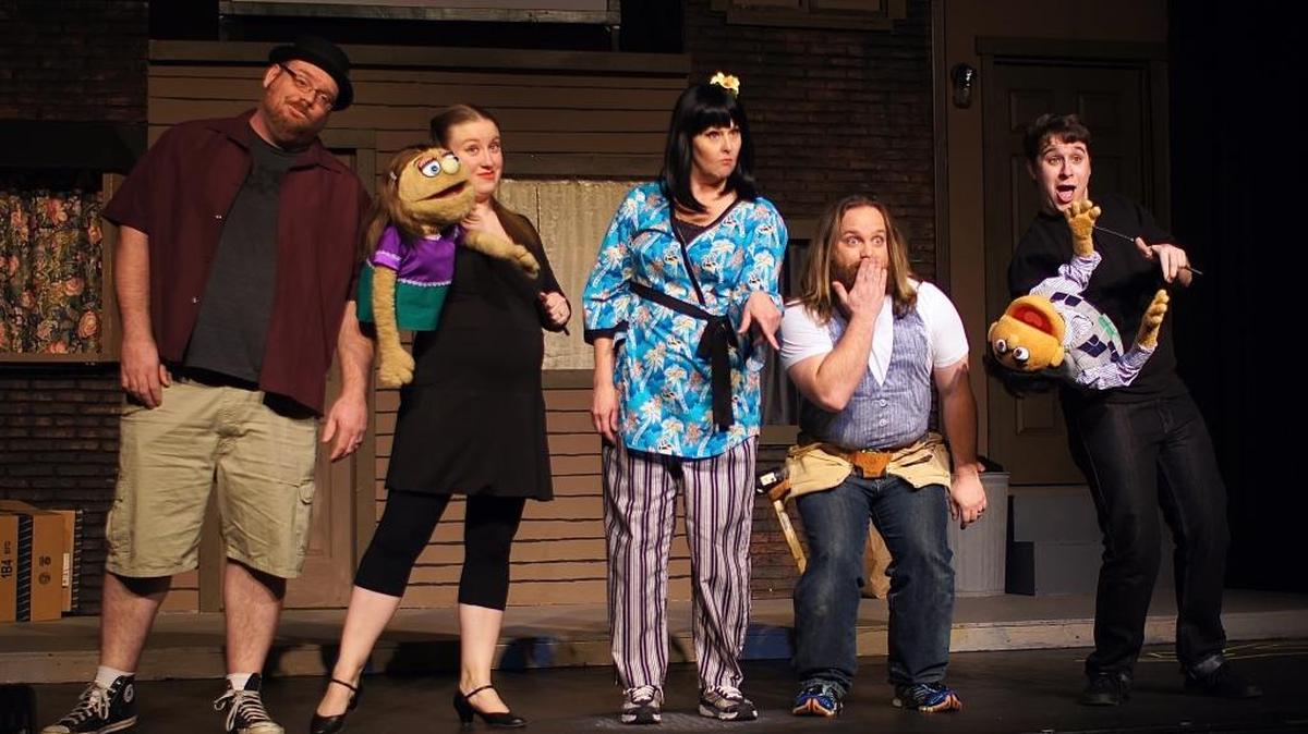 Actors and puppeteers Josh Noll, left to right, Megan Noll, Lynn Huelsmann, Joshua Peebels and Tyler Woods rehearse a scene from “Avenue Q,” which will be performed at Looking Glass Playhouse.