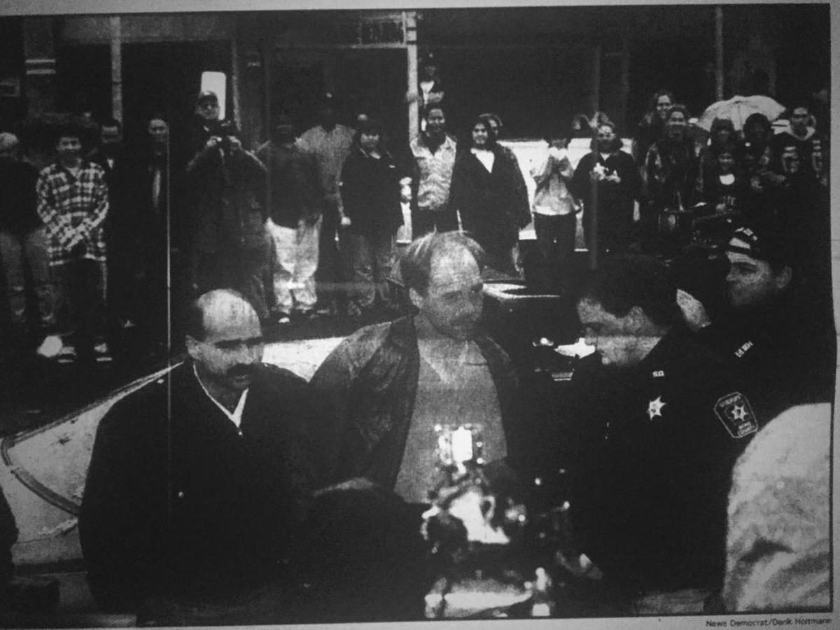 Kelly McGinnis being led into the Bond County courthouse for a hearing in Nov. 1996.