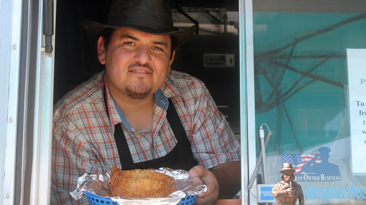 Oscar Farina sells Argentinian dishes from his food truck, Los Gauchos Argentinian Grill. The truck, regularly outside Scott Air Force Base, will be at St. Peter Cathedral parish’s Food Truck Fest on Saturday.