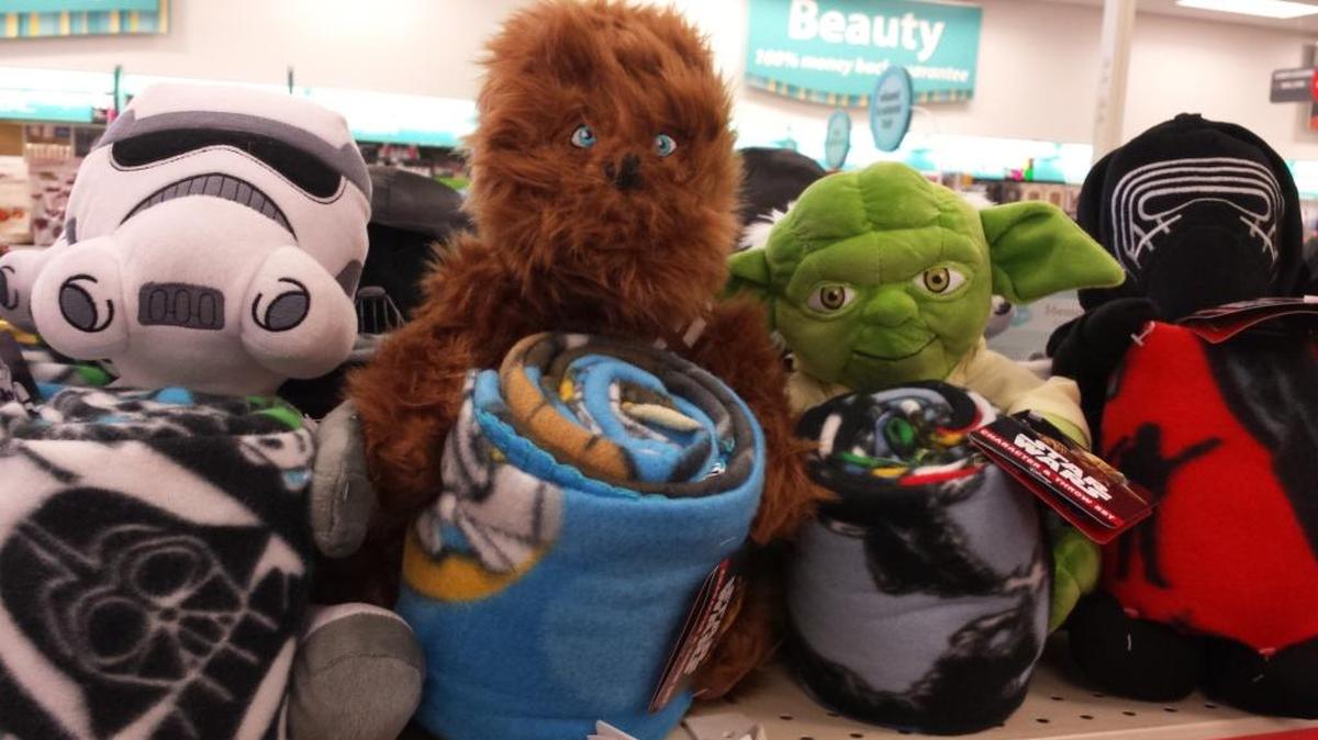 Cuddle up with “Star Wars” fleece blanket and plush character from CVS Pharmacy in Swansea.