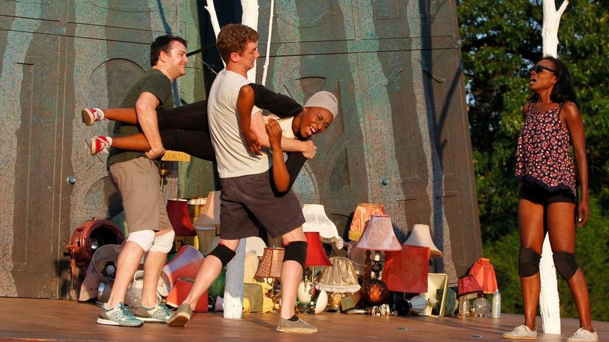 Justin Blanchard (Lysander) and Pete Winfrey (Demetrius) carry Cassia Thompson (Hermia) across the stage as Rachel Christopher (Helena) looks on. during a rehearsal for the Shakespeare Festival St. Louis’ 2016 production of “A Midsummer Night’s Dream.”