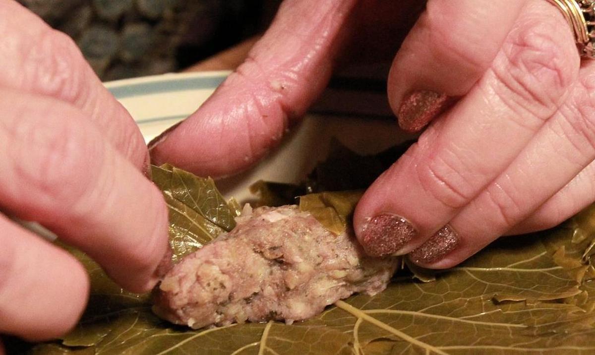 Norma Asadorian rolls dolma, a type of Armenian food.