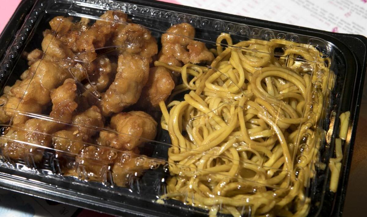 A to go combination meal of General Chicken and Lo Mein Noodles at House of Chiu 3605 N. Belt West, Belleville. The restaurant offers carry out, dine in and limited delivery.