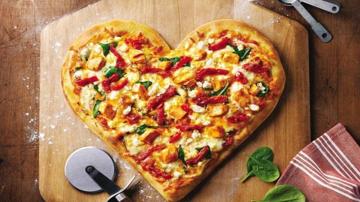 Valentine Pizza is easy to shape, whether you use your own homemade dough or the store-bought refrigerated kind.