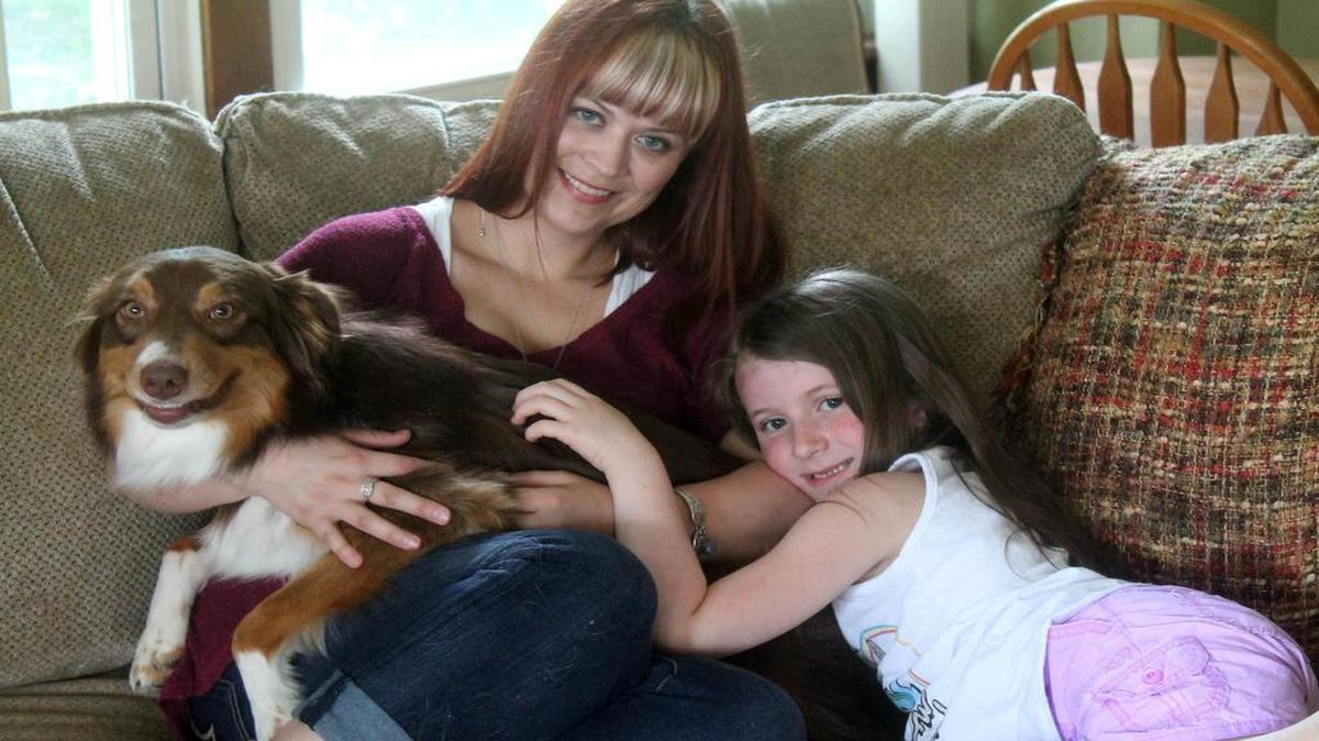
One of young adult author Nicole Lanahan's favorite places to write is sitting on the sofa in her Collinsville home. On a recent Friday, she had some company — daughter Rianne and one of their dogs. Nicole, whose pen name is Cole Gibsen, recently had her book, "Life Unaware," publlished.
