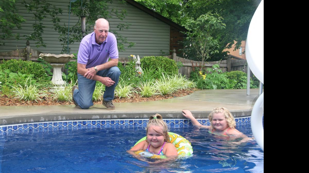 
Sterling Garnto worked to get his garden in shape for a tour last June; then had the yard dug up to put in a pool for granddaughters, Meta, 8, and Nina, 4.
