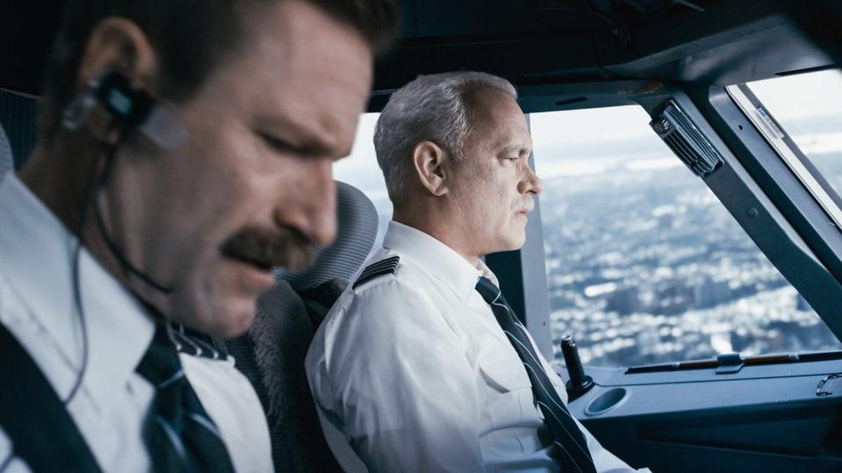 This image released by Warner Bros. Pictures shows Tom Hanks, right, and Aaron Eckhart in a scene from "Sully."