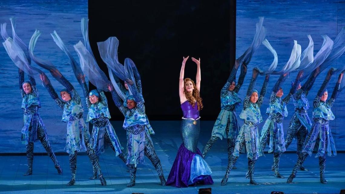 ​Emma Degerstedt as Ariel, surrounded by the ‘water girls’ in The Muny’s production of “The Little Mermaid.”