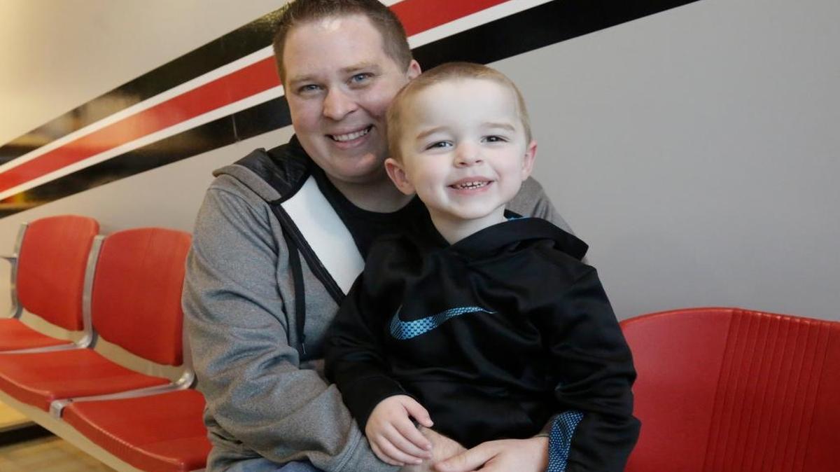 In this April 6, 2016, photo, Ed Izenstark and his son Chase, 4, pose in St. Charles, Ill. Izenstark inherited a genetic predisposition to Huntington’s disease from his birth father, but he only learned of his susceptibility to the fatal nerve disorder after requesting information about his adoption from a state agency last December.