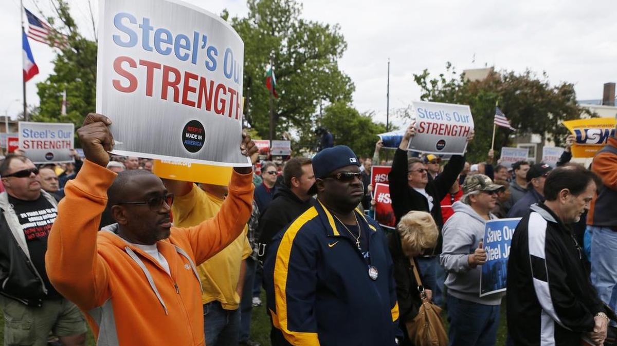 People participate in a save our jobs rally in July for steelworkers in Granite City.