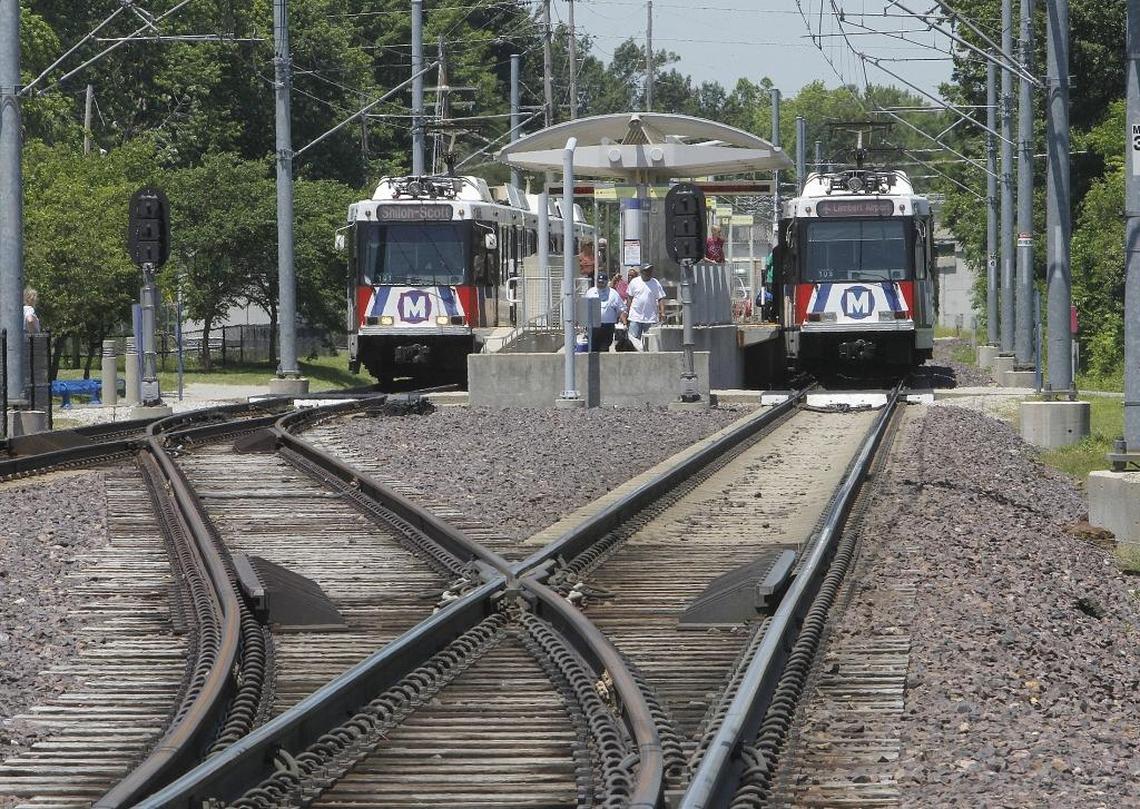 Passengers load and unload from eastbound and westbound MetroLink trains stopped at the Scheel Street Station in Belleville in this BND file photo.