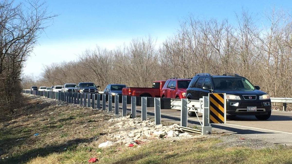 Traffic is backed up along eastbound Illinois Route 50 Sunday as cars turn around where the road is blocked at Quarry Road west of Lebanon.