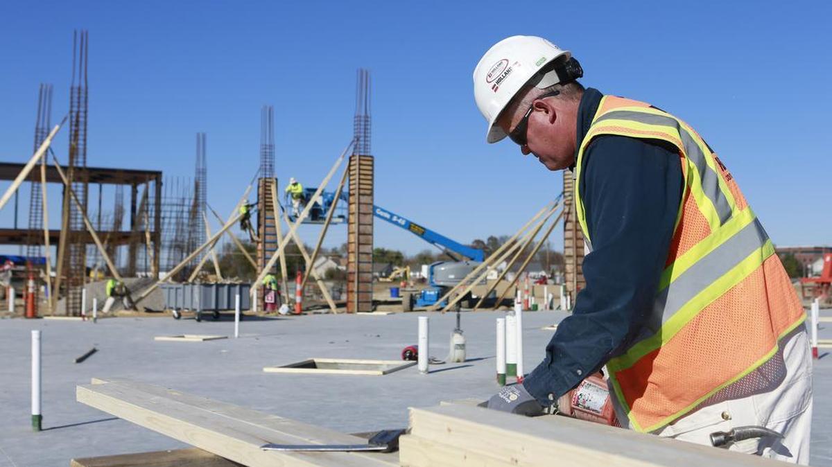 Ron Koopman, a carpenter and superintendent with Holland Consruction Services works on the new St. Elizabeth's facility in O'Fallon on Friday afternoon.