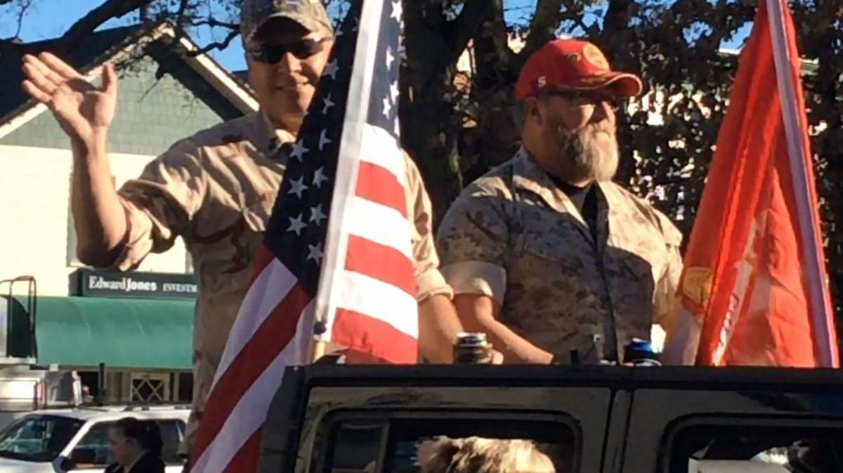 Veterans Keith Miller, Navy, and Bill Sloan, Marines, ride in the Veterans Day Parade in Highland.