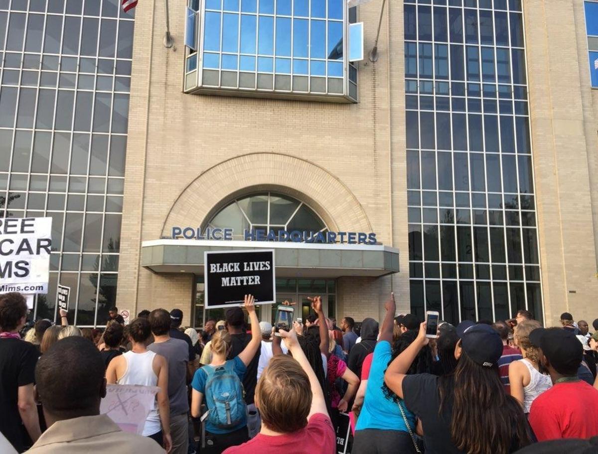 Protesters gather outside St. Louis Metropolitan Police Department headquarters Sunday afternoon in St. Louis during a peaceful demonstration decrying the not-guilty verdict handed down by a judge Friday in the murder trial of former St. Louis police officer Jason Stockley.