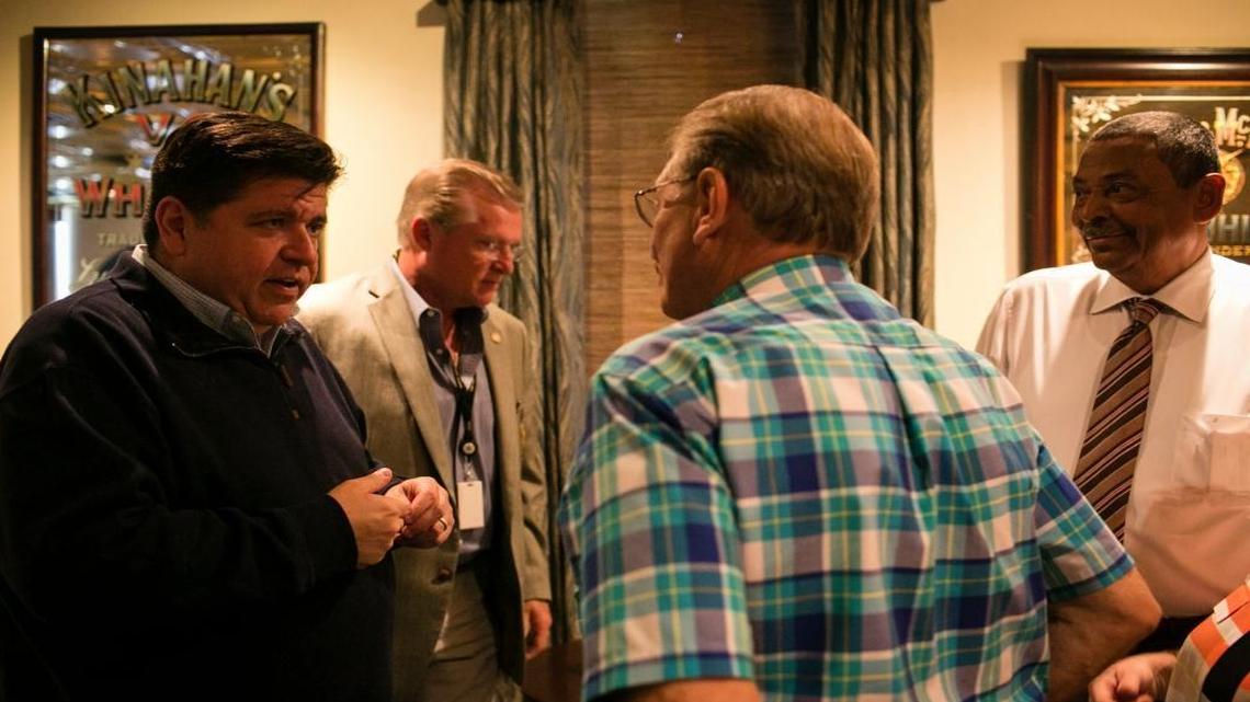 J.B. Pritzker, left, spoke on Monday with members of the St. Clair County Democratic Central Committee, which endorsed him.