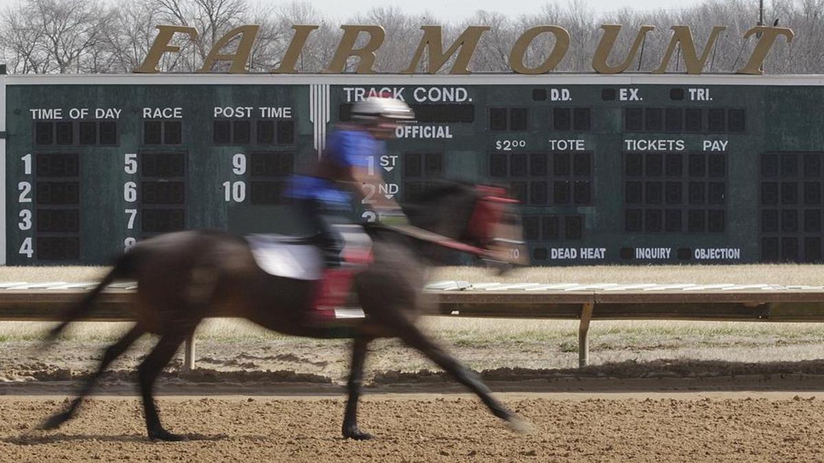 
A rider and horse train at Fairmount Park Racetrack in Collinsville.
