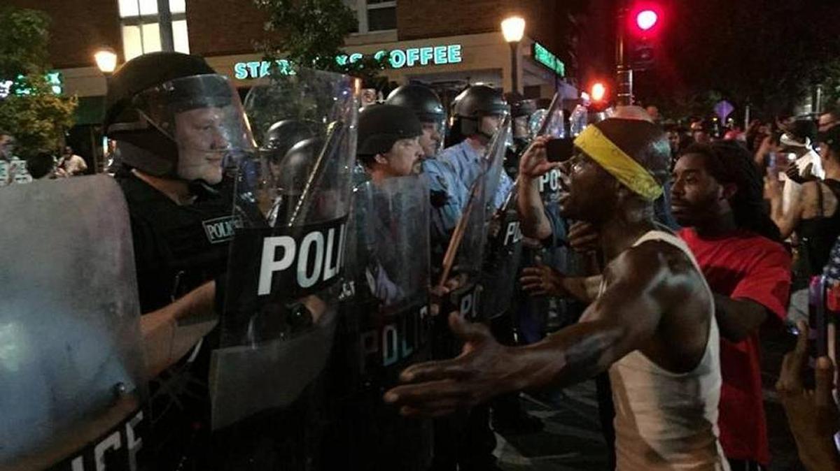 A protester faces off with police during early days of the St. Louis protests about former police officer Jason Stockley’s not-guilty verdict in the shooting death of Anthony Lamar Smith.