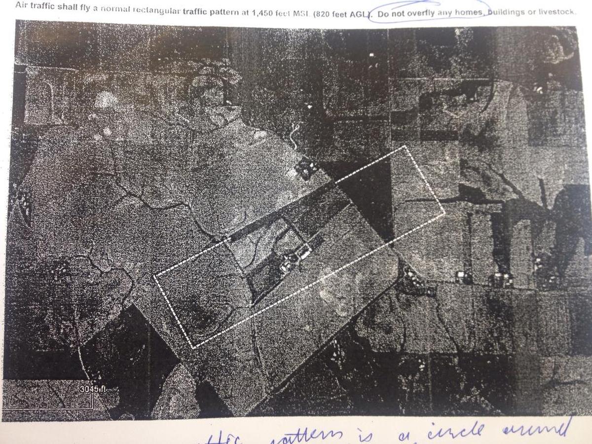 The flight route for Heitman Airport goes between two properties, but planes do not always fly by that path.