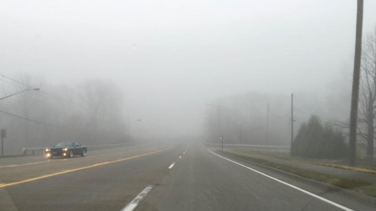 Fog shrouds traffic on Illinois 159 in Swansea about 8: 30 a.m. Friday.
