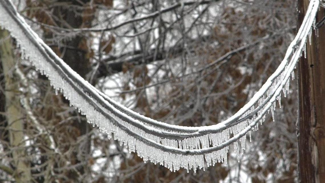 In this BND file photo from 2016, ice buildup on a power line causes the wires to droop.
