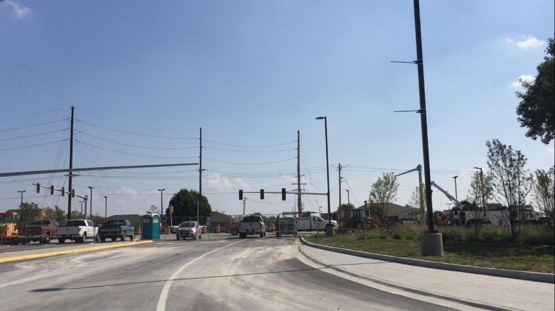 Construction crews work Tuesday morning on the intersection of North Green Mount Road and Cambridge Boulevard.