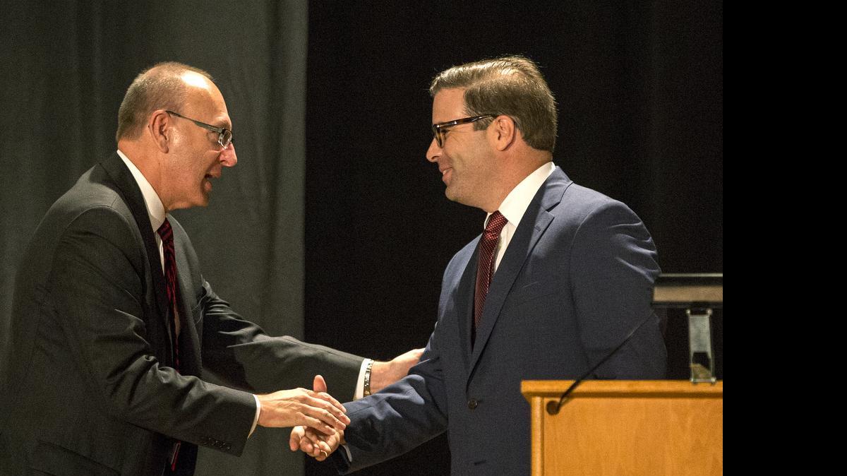 
Dr. Michael D. Shonrock, who began his tenure on June 1, 2015, as Lindenwood University’s 22nd president, congratulates Brett Barger as Lindenwood University-Belleville’s interim campus president on Wednesday.
