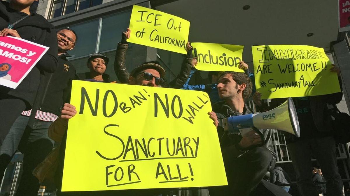 Protesters in San Francisco rally against President Donald Trump’s push to deport illegal immigrants in April. San Francisco is one of several U.S. cities working to make 1 million immigrants citizens in 2017.