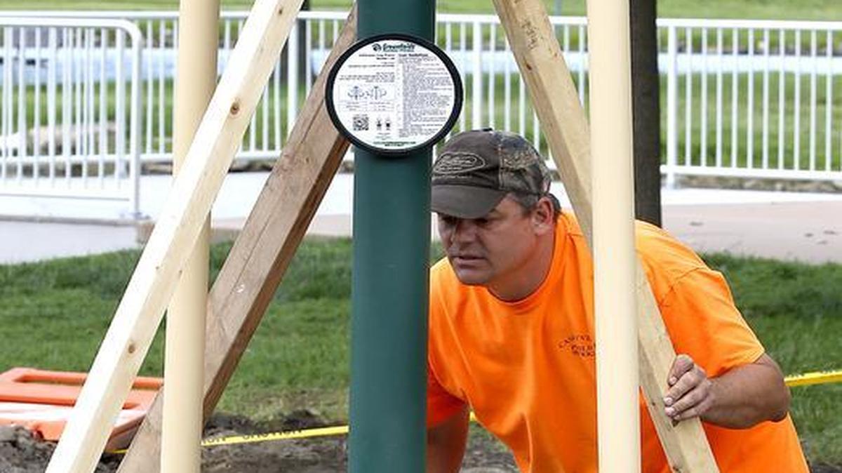 
Caseyville Public Works employees Randy Smith (left) and Paul Rukavina install and secure some of the new exercise equipment at Caseyville Village Park.
