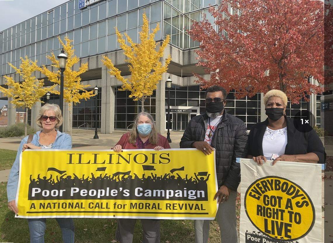 The metro-east chapter of the Poor People’s campaign of Illinois holds a demonstration outside of U.S. Sen. Tammy Duckworth’s office Wednesday, calling on the senator to “hold the line” on President Joe Biden’s Build Back Better plan.