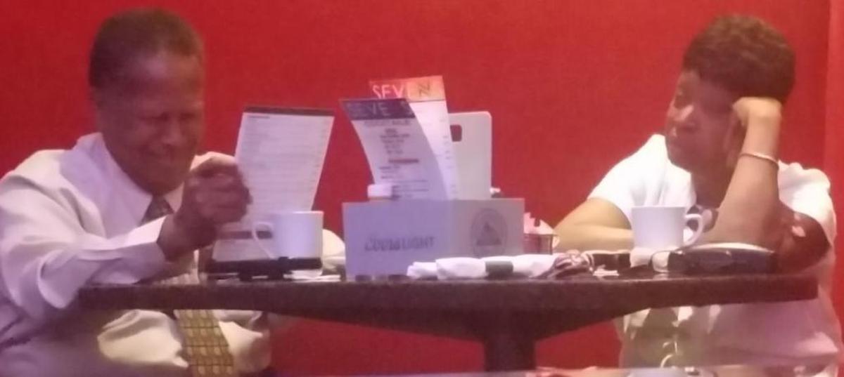 Ellis and Johnson are shown in a surveillance photo taken at the Sevens bar and restaurant at the Casino Queen.