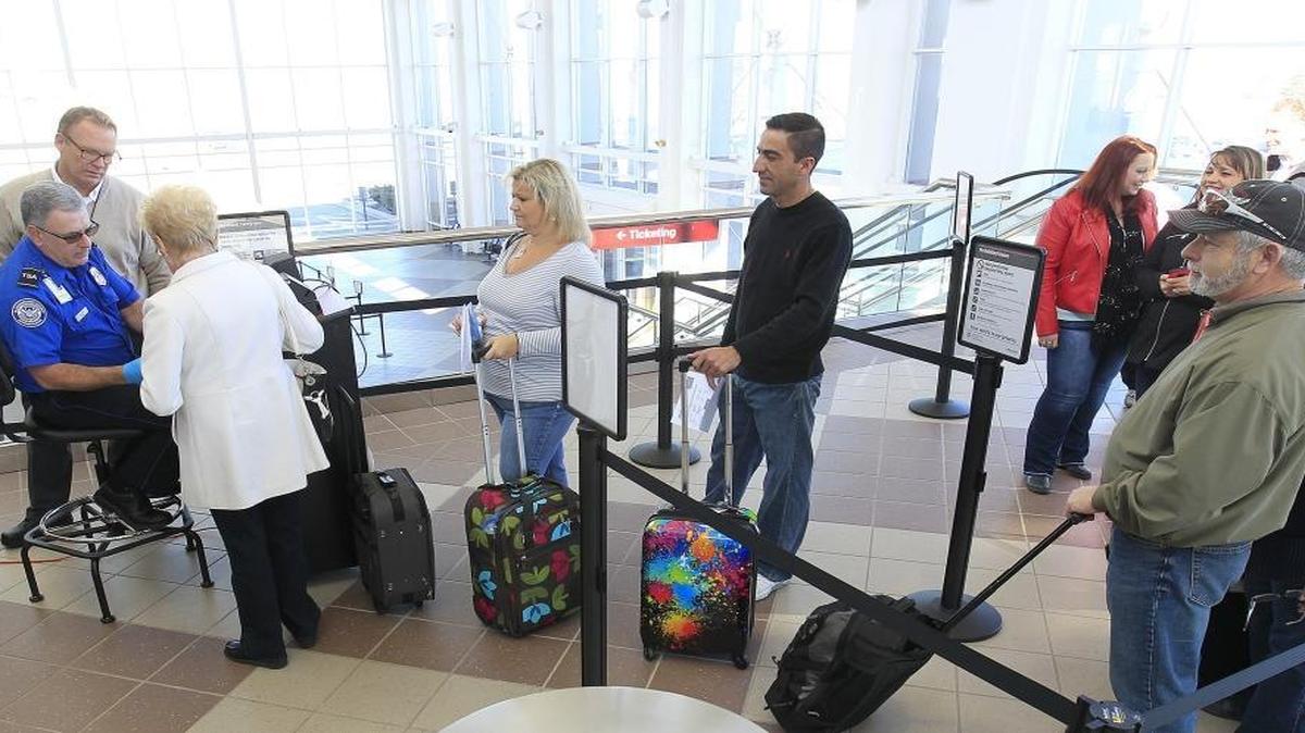 Allegiant Air passengers go through check-in at MidAmerica Airport for a flight to Las Vegas in this file photo from January.