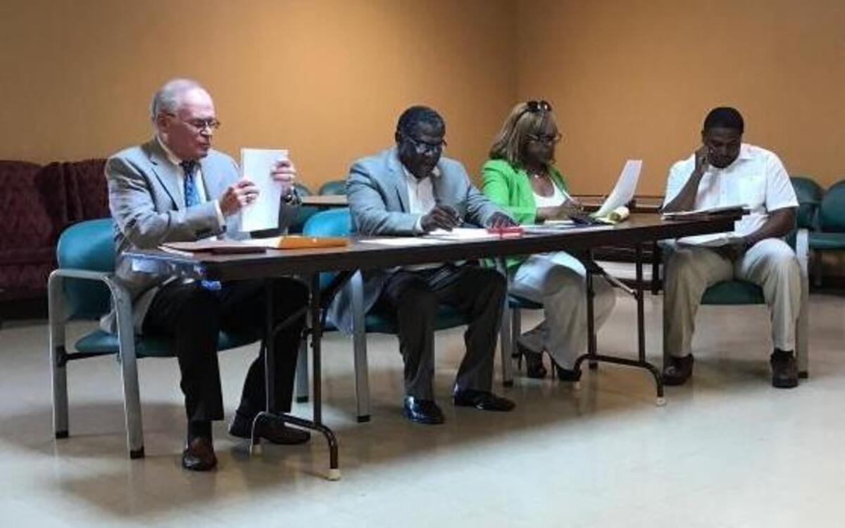 Willie Ray, third from left, was appointed by her brother, Rickie Thomas, to fill his unexpired term as village clerk in Washington Park.