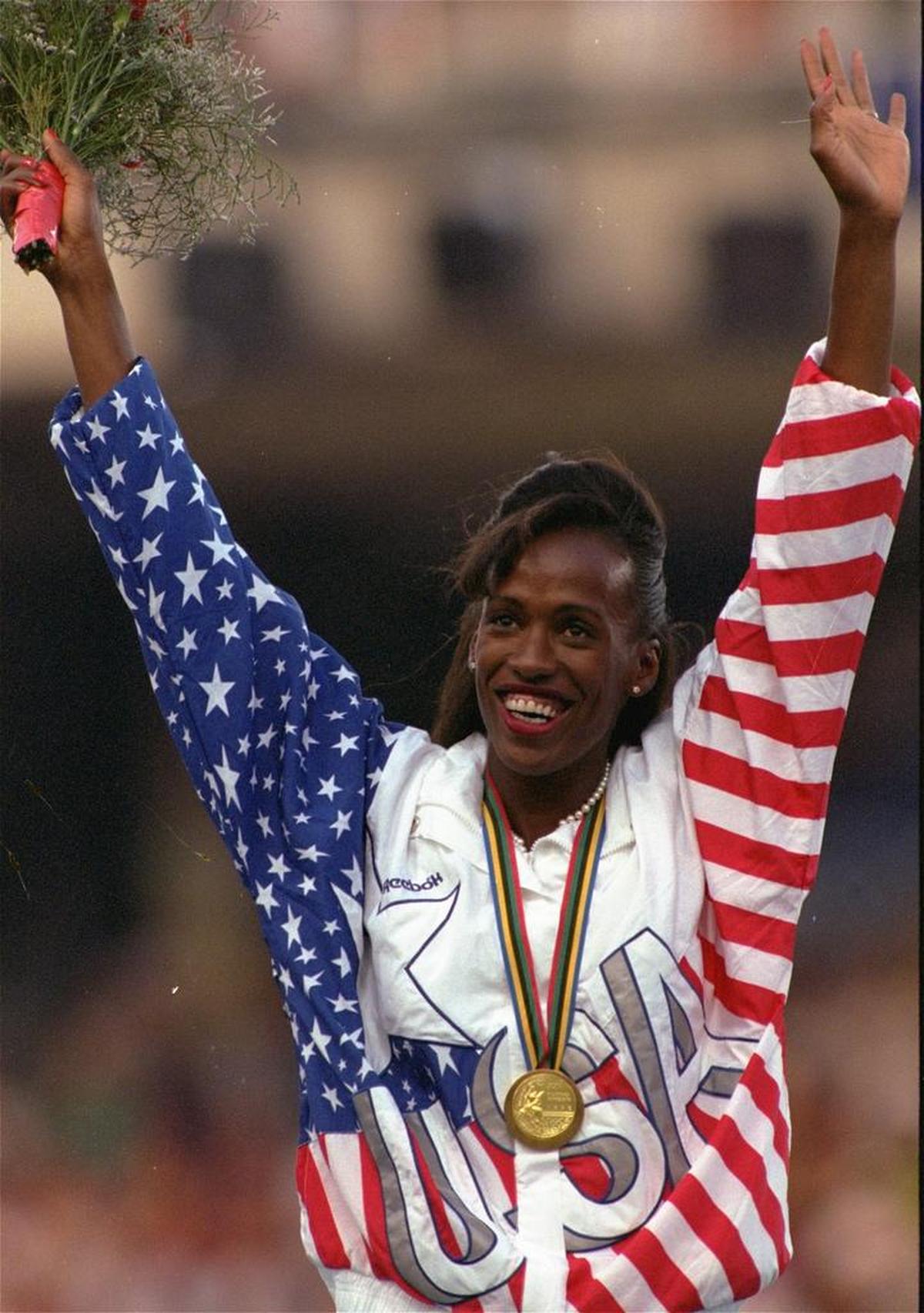 USA’s Jackie Joyner-Kersee waves during medal ceremonies for the women’s heptathlon at the Olympic Games in Barcelona in 1992. Joyner-Kersee received the gold in the event.