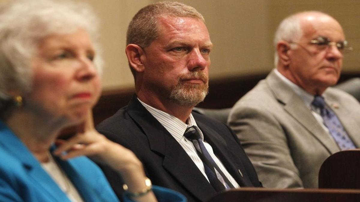 Former Collinsville City Manager Scott Williams (center), Councilwoman Nancy Moss and Mayor John Miller listen to residents during the July 13, 2015, City Council meeting.