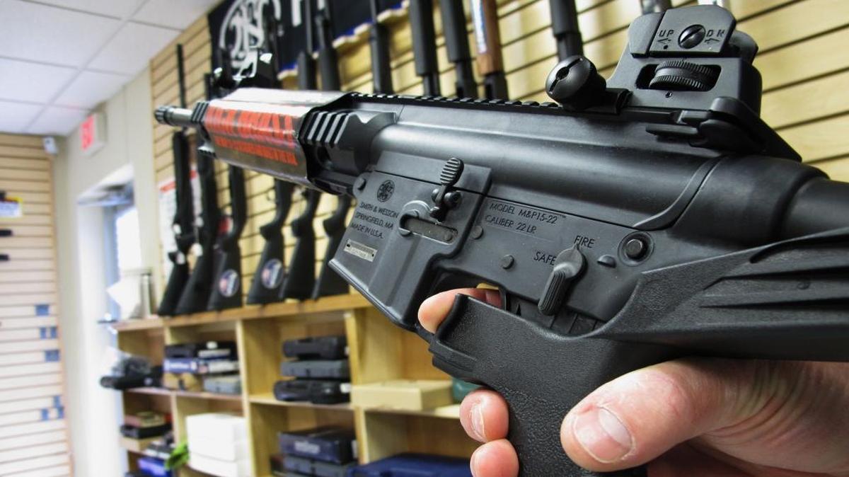 In this Feb. 1, 2013, file photo, an employee of North Raleigh Guns demonstrates how a “bump” stock works at the Raleigh, N.C., shop. The gunman who unleashed hundreds of rounds of gunfire on a crowd of concertgoers in Las Vegas on Monday attached what is called a “bump stock” to two of his weapons, in effect converting semiautomatic firearms into fully automatic ones.