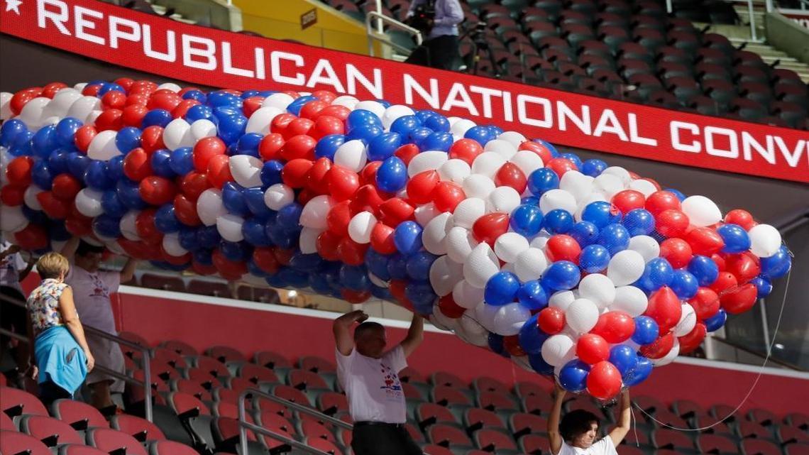 Workers carry balloons as preparations continue for the Republican National Convention at the Quicken Loans Arena in Cleveland.