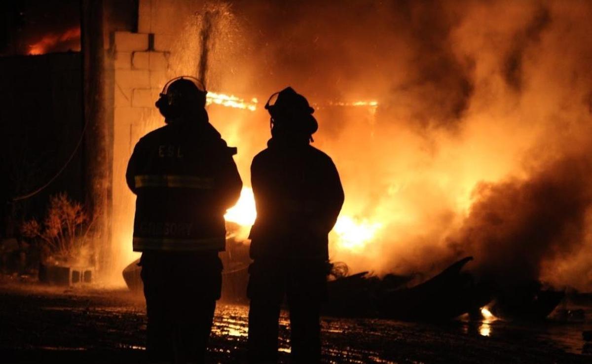 East St. Louis firefighters battle a blaze at Classic Tires in East St. Louis on July 5, 2017.