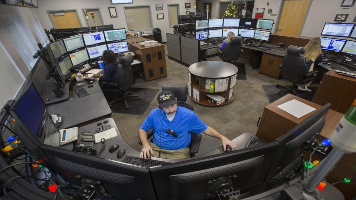 Telecommunicator Jared Runyan and others work in the new 911 call center in O’Fallon. An Edwardsville dispatcher, not pictured, helped a mom and dad deliver their baby over the phone Tuesday.