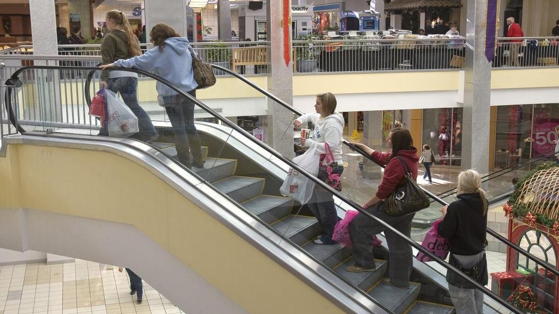 In this file photo, shoppers ride an escalator at St. Clair Square.