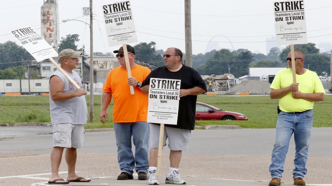 
Tom Jones (from left), Dave Boatwright Tom Voegele and Jim Hayes stand with signs along Illinoiis 157 Thursday in Caseyville near Breckenridge of Illinois, LLC which produces concrete to be distributed. Jones and the others are members of the International Brotherhood of Teamsters Local 50 and are among the area Teamster truck drivers who went on strike Thursday and are picketing in various locations.
