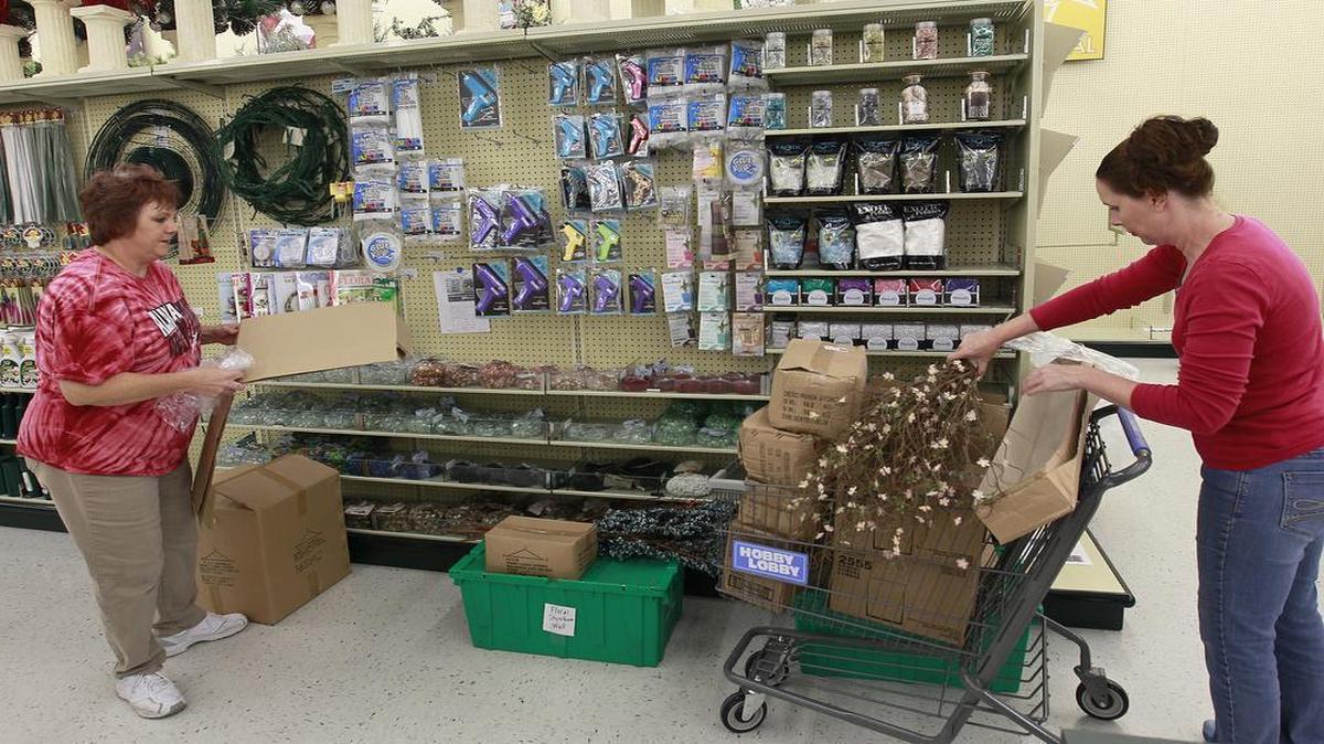 Hobby Lobby has been at its current location for the past 16 years — now it has moved to the Fairview City Centre shopping plaza, with greater visibility to shoppers along North Illinois Street (Illinois Route 159). Here, floral designer Teresa Smith (left) and floral department manager Julie Tapp unbox merchandise at the new store and put it on display racks in advance of the store’s Monday opening.