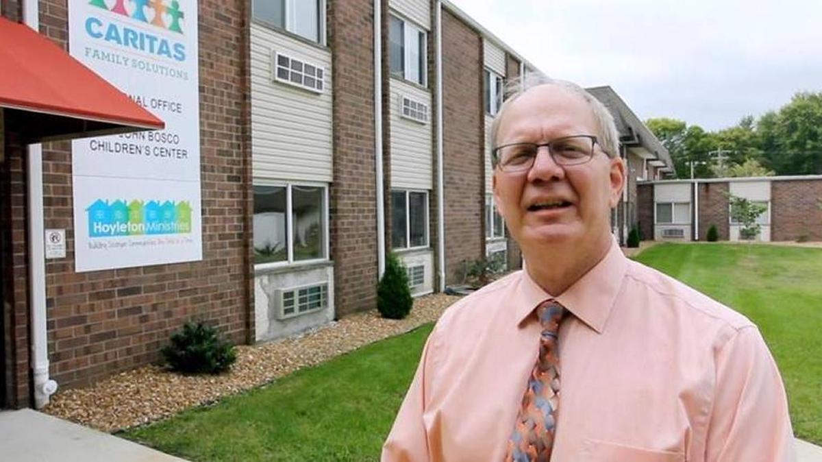 Caritas Family Solutions CEO Gary Huelsmann stands outside the St. John Bosco Children’s Center in September 2016.