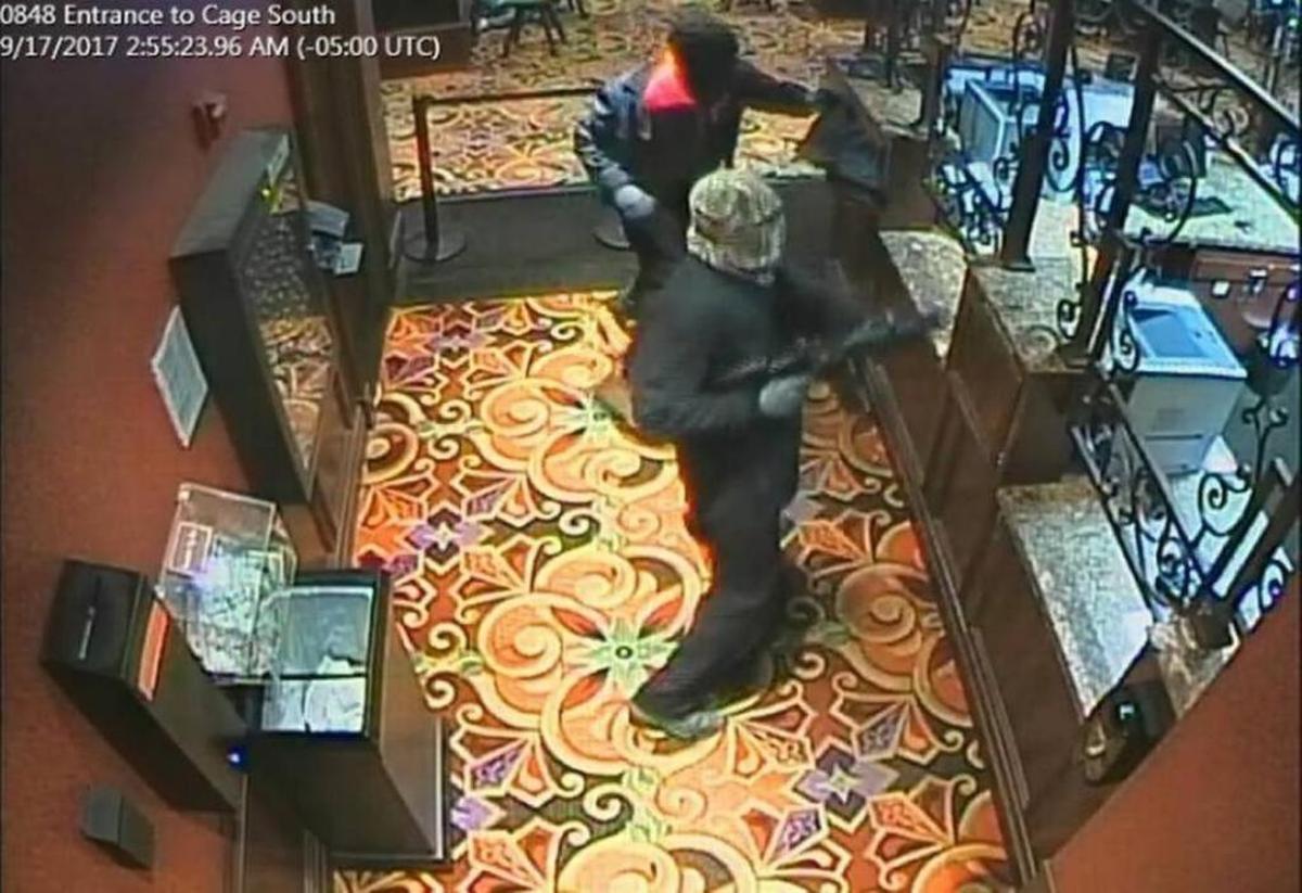 Surveillance images of masked gunmen during an armed robbery of the Casino Queen in East St. Louis Sept. 17, 2017.